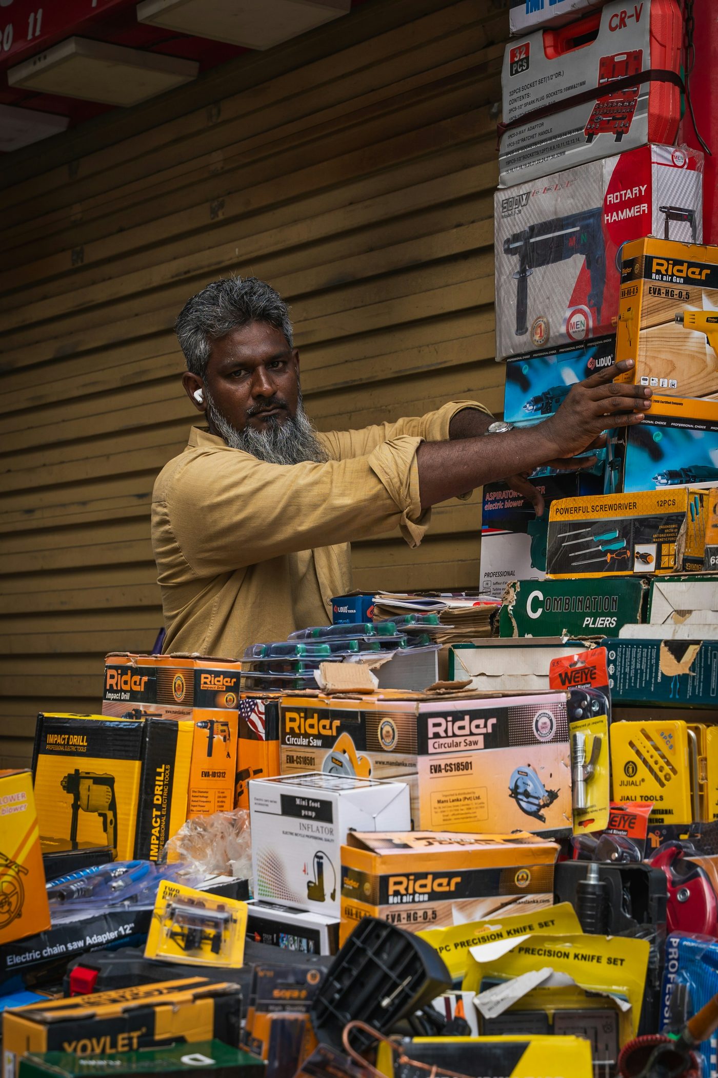A hardware store worker arranging tools and supplies